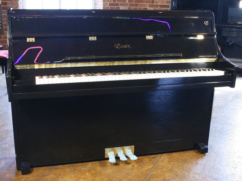 A brand new Essex 108 upright piano with a black case and polyester finish. Piano  has an eighty-eight note keyboard and three pedals.