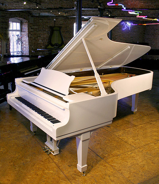 A Steinway Model D concert grand piano with a white case and polyester finish