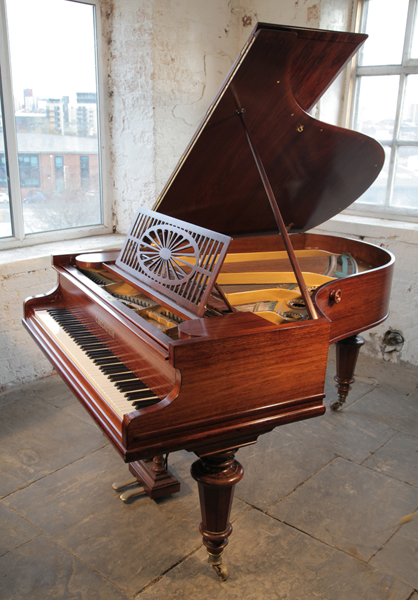 A 1904, Bechstein Model A grand piano with a polished, rosewood case and turned legs. 