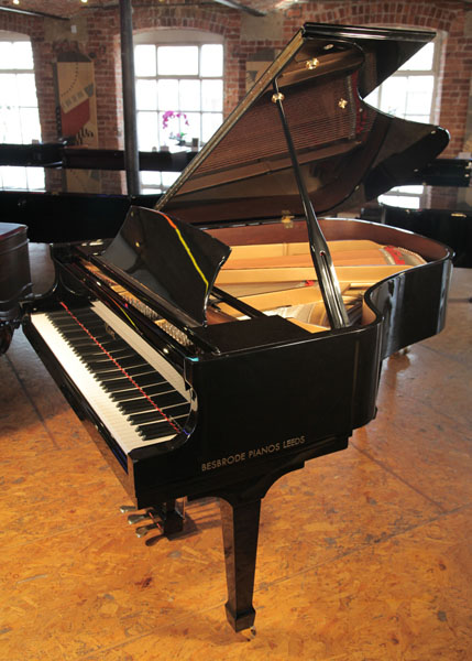 A Brodmann BG187 grand piano for sale with a black case and spade legs