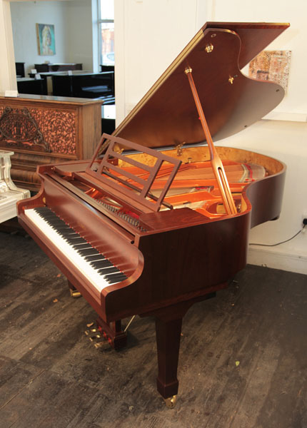 Brand new, Feurich Model 178 Professional grand piano with a satin, walnut case and fitted iQ Pianodisc player system. Piano has a three-pedal lyre and an eighty-eight note keyboard. 