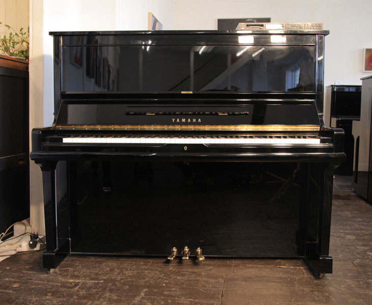 A 1991, Yamaha U30A upright piano with a black case and polyester finish. Piano features a fitted Disklavier MX100 player system.