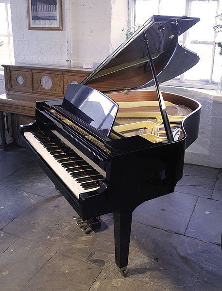A 1994, Yamaha GH1 baby grand piano for sale with a black case and square, tapered legs. Piano has an eighty-eight note keyboard and a three-pedal lyre 