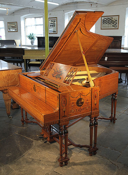 A 1908, Steinway with a satinwood case, hand-painted with Berainesque decoration featuring arabesques, flowers, urns, swags, bows, musical instruments and plaques with cherubs and reclining ladies