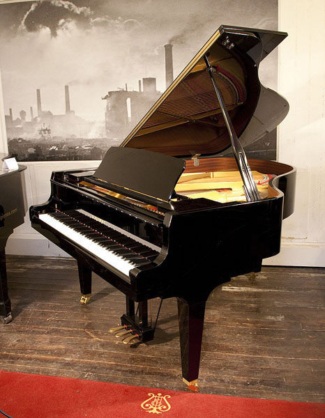 A 2017, Kawai GL-50 grand piano for sale with a black case and square, tapered legs. Keyboard lide features a slow fall mechanism.