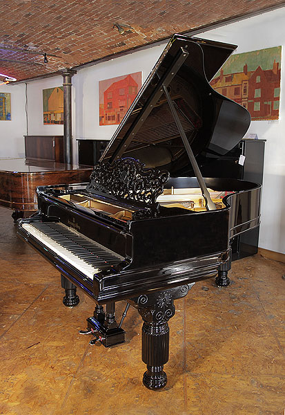 An 1884, Steinway Model A grand piano for sale with a black case, filigree music desk and fluted, barrel legs. Piano has an eighty-eight note keyboard and a two-pedal lyre.
