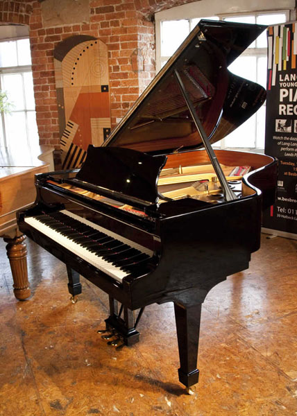 A 2003, Steinway Model A grand piano with a black case and spade legs