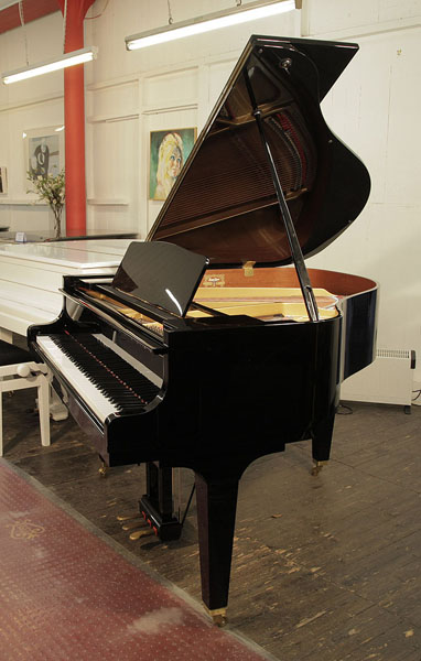 A 2014, Kawai GM-10 baby grand piano for sale with a black case and square, tapered legs.