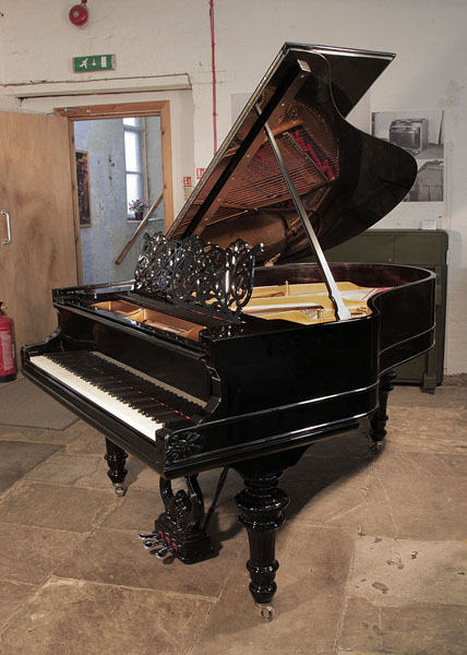 An 1879, Steinway Model A grand piano for sale with a black case, filigree music desk and carved, turned legs. Piano has an eighty-five note keyboard and a three-pedal lyre.