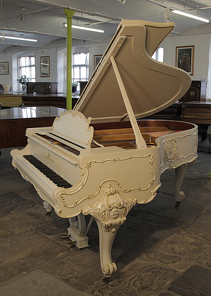 A 1979, Louis XV style, Steinway Model O grand piano for sale with an off-white case and ornately carved, cabriole legs. Entire cabinet features Rococo style, carvings accented with gilt detail. Piano comes with a matching piano stool.  