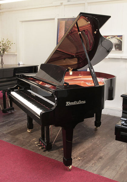 Reconditioned, 2005, Wendl and Lung Model 161 grand piano with a black case and polyester finish. Piano has an eighty-eight note keyboard and a three pedal lyre 