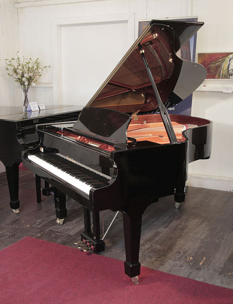 Pre-owned, Wendl and Lung Model 178 grand piano with a black case and polyester finish. Piano has an eighty-eight note keyboard and a three pedal lyre 