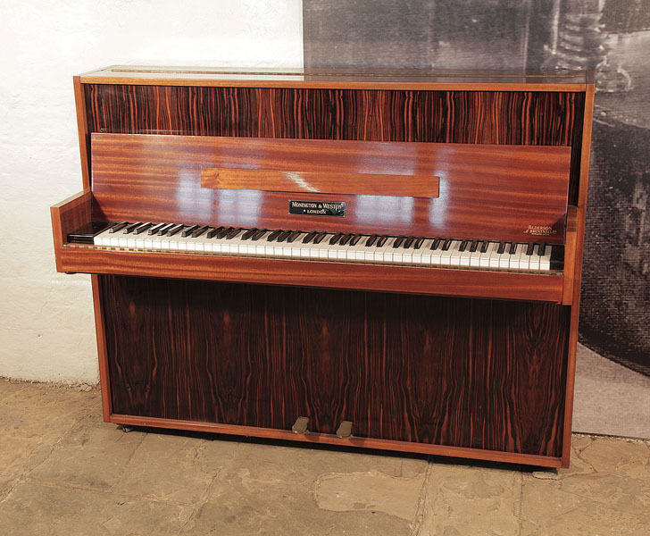 Mid Century Modern style, 1956, Monington and Weston upright piano for sale with a contrasting mahogany and macassar ebony case. Piano has an eighty-five note keyboard and two pedals.