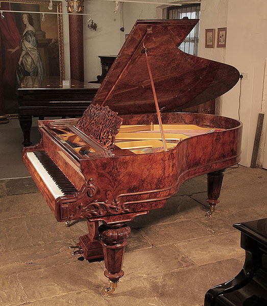 Restored, Schiedmayer grand piano for sale with a french polished, burr walnut cabinet and carved, faceted legs. Piano has an eighty-five note keyboard and a two-pedal lyre.