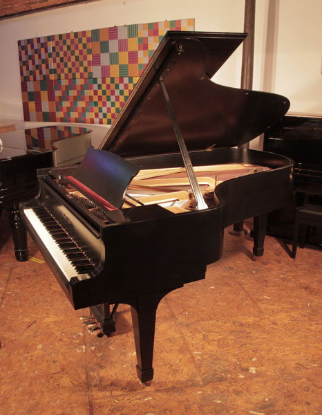 Restored, 1935, Steinway Model B grand piano with a satin, black case and spade legs. Piano has an eighty-eight  note keyboard and a three-pedal  lyre