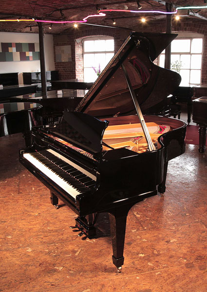 Rebuilt, 1932, Steinway Model M grand piano for sale with a black case and spade legs.  Piano has been rebuilt in Germany by Steinway Academy trained technicians using 100% Steinway parts 