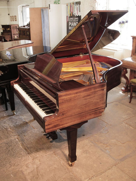 Reconditioned, 1992, Bluthner model 10 grand piano for sale with a mahogany case and spade legs. Piano has an eighty-eight note keyboard and a three-pedal lyre.   