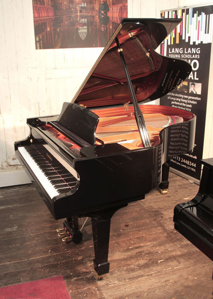 Reconditioned, 2004, Wendl and Lung Model 178 grand piano with a black case and polyester finish. Piano has an eighty-eight note keyboard and a three pedal lyre  