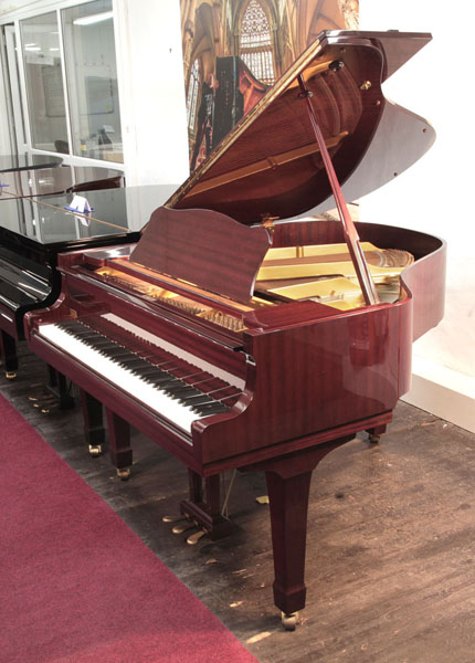 Reconditioned, 1989,  Yamaha G1 baby grand piano with a mahogany case and spade legs. Piano has an eighty-eight note keyboard and a three-pedal lyre.  