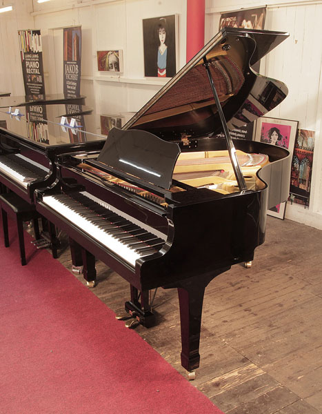 Reconditioned, 1978, Yamaha G2 grand piano for sale with a black case and spade legs. Piano has an eighty-eight note keyboard and a two-pedal lyre.
 
