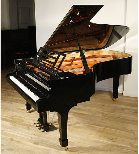 Brand new, Feurich model 218 concert grand piano with a black case and brass fittings.