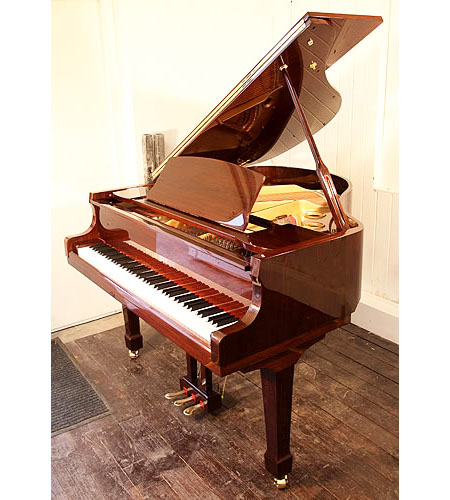Brand new, Steinhoven Model 148 baby grand piano with a mahogany case and polyester finish. Piano has an eighty-eight note keyboard and a three-pedal piano lyre.