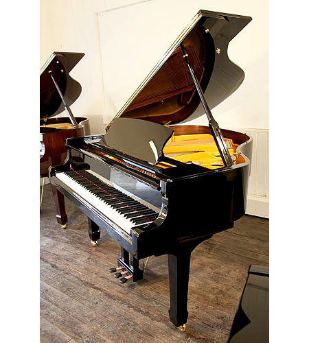 Brand new, Steinhoven Model 160 baby grand piano with a black case and polyester finish. Piano has an eighty-eight note keyboard and a three-pedal piano lyre.