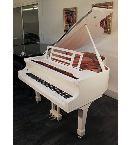 Brand new, Feurich Model 161 Professional grand piano with a white case and chrome fittings.  Piano has an eighty-eight note keyboard and a three-pedal piano lyre. 