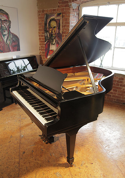 A 1972, Steinway Model A grand piano with a black case and spade legs