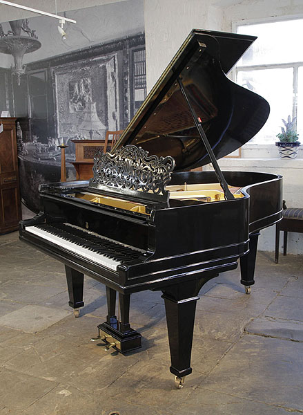 Antique 1900, Steinway Model A grand piano for sale with a black case, filigree music desk and spade legs. Piano has an eighty-eight note keyboard and a two-pedal lyre. 