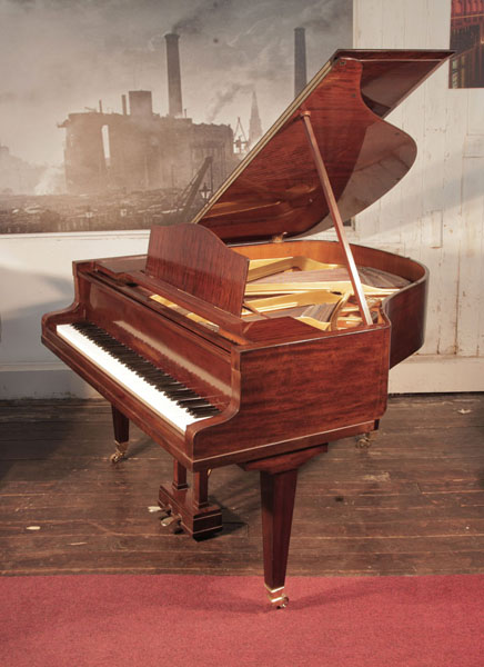 Reconditioned, 1932, Bluthner baby grand piano for sale with a mahogany case. Piano has an eighty-eight note keyboard and a two-pedal lyre. 