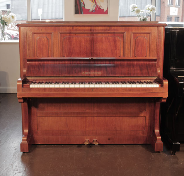 Reconditioned, 1924, Bechstein  model 8  upright piano with a rosewood case and brass fittings. Piano has an eighty-eight note keyboard and two pedals. 