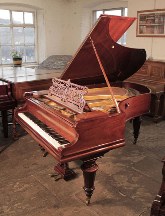 Antique, 1899, Bechstein model V grand piano for sale with a rosewood case and turned, faceted legs.  Piano has an eighty-eight note keyboard and a two-pedal lyre. 