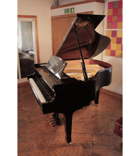 Reconditioned, 2009, Boston GP156 II baby grand piano with a black gloss case and spade legs. Piano has an eighty-eight note keyboard and a three-pedal lyre.
