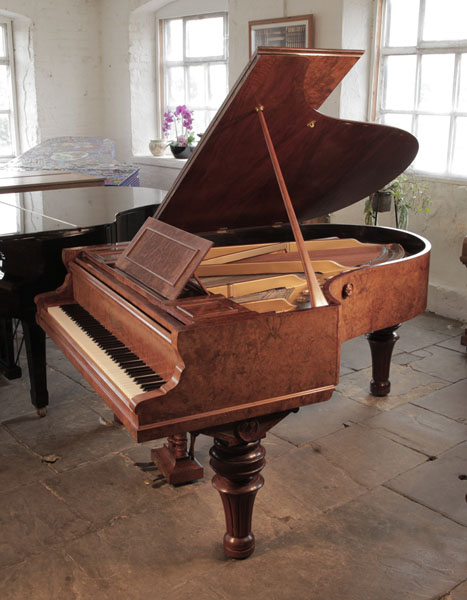 An  1893, Ronisch grand piano for sale with a burr walnut case and turned, fluted legs. Piano formerly the property of Steve Harley from the band Cockney Rebel.  Piano has an eighty-eight note keyboard and a two-pedal lyre. 