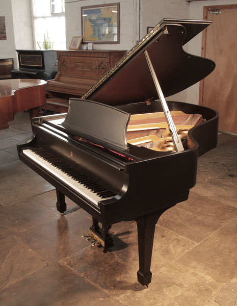 Reconditioned, 1978, Steinway Model L grand piano for sale with a black, satin case and spade legs. Piano has an eighty-eight note keyboard and a three-pedal lyre 