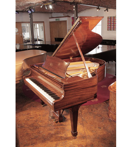 Rebuilt, 1937, Steinway Model S baby grand piano with a crown cut mahogany case and spade legs. Piano has an eighty-eight note keyboard and a two-pedal lyre.