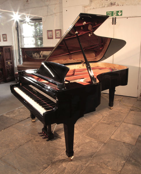 Reconditioned, 2008,  Wendl and Lung model 218 concert  grand piano for sale with a black case and dual casters. Piano has an eighty-eight note keyboard and a three pedal lyre  