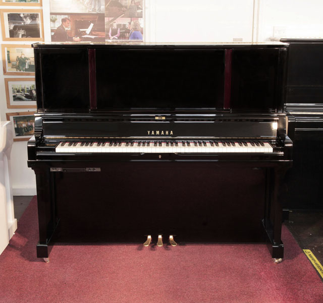 A 2019, YUS5 SH2 upright piano for sale with a black case and brass fittings. Piano has a fitted silent system. Condition as new. Piano has an eighty-eight note keyboard and three pedals.
 