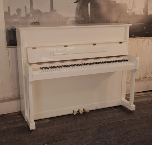 Reconditioned 2008, May upright piano in ivory gloss with brass fittings.  Piano has an eighty-eight note keyboard and and three pedals 