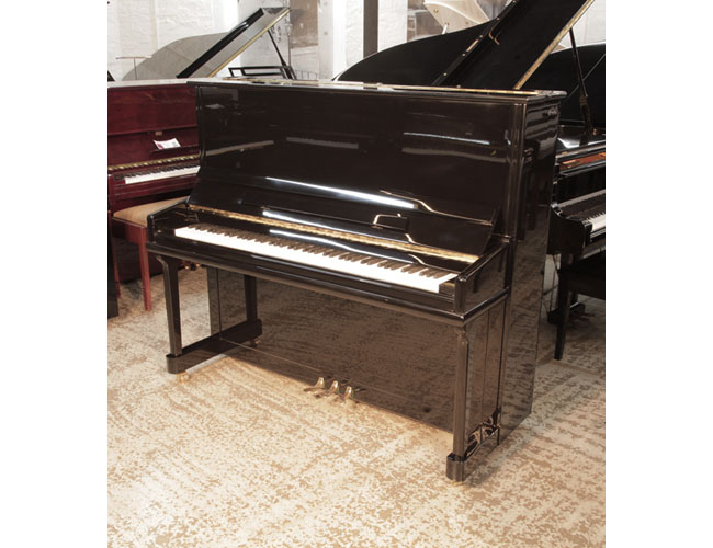 Reconditioned 2011, Besbrode upright piano for sale with a black gloss case. Piano has an eighty-eight note keyboard and three pedals.