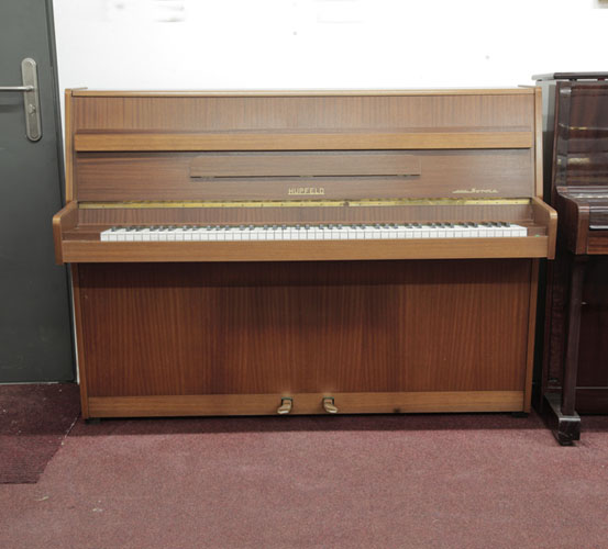 Vintage, Hupfeld Norma upright piano with a mahogany case.Piano has an eighty-eight note keyboard and two pedals. 