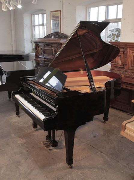 A 1985, Kawai GS-30  grand piano for sale with a black gloss case and spade legs. Piano has an eighty-eight note keyboard and a three-pedal lyre. 