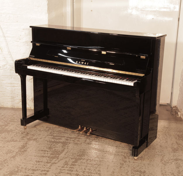 As new,  Kawai  K-2  upright piano for sale with a black gloss case. Piano has an eighty-eight note keyboard and three pedals.  