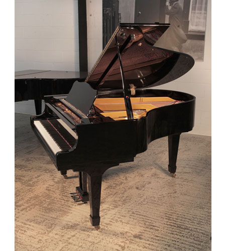Opus grand piano for sale with a black gloss case and brass fittings.