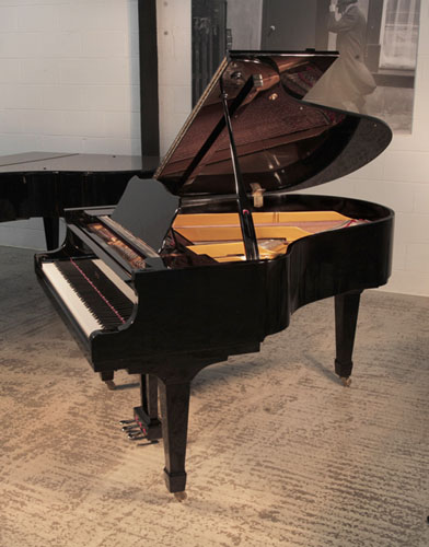 Opus grand piano for sale with a black gloss case and brass fittings