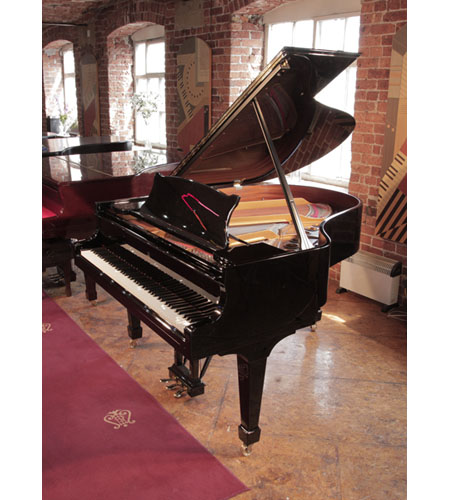 Reconditioned, 1996, Steinway Model M grand piano with a with a black case. Piano has an eighty-eight note keyboard and a three-pedal lyre.