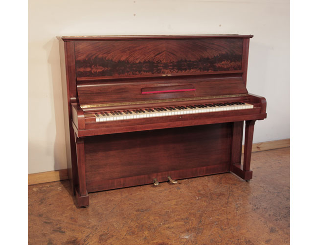 Reconditioned 1937, Steinway model V upright piano with a mahogany case and brass fittings. Piano has an eighty-eight note keyboard and two pedals . 