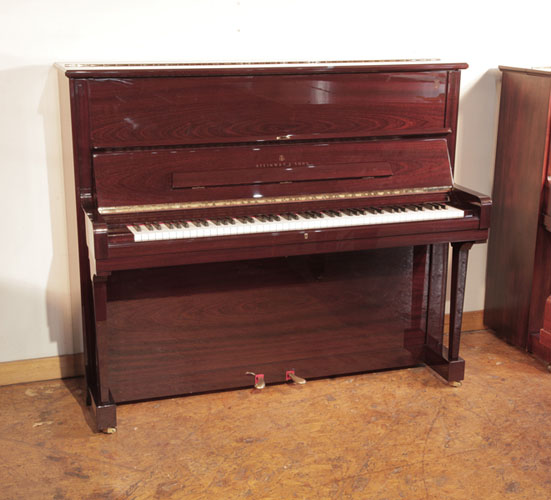 A 2009, Steinway Model V  upright piano for sale with a mahogany gloss case. Piano has an eighty-eight note keyboard and two pedals. 