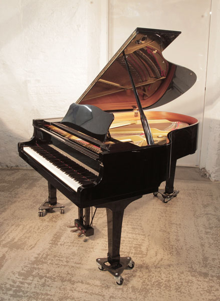A 198, Yamaha C3 grand piano for sale with a black gloss and spade legs. Piano has an eighty-eight note keyboard and a three-pedal lyre. 